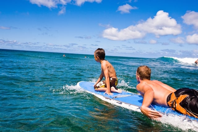 Father and son tandem surfing